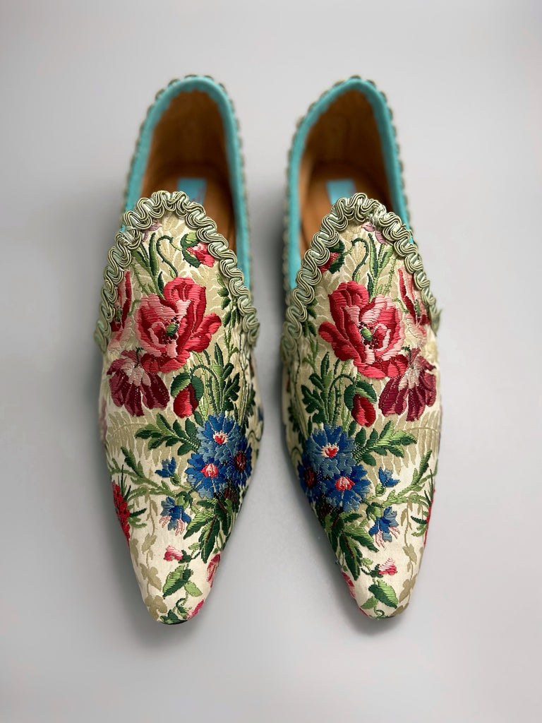 Vita embroidered floral silk brocade bohemian shoes created from antique textiles by PavilionParade. Cottage garden flowers poppies and cornflowers in reds pinks and blues on a pale sage bone ground. 