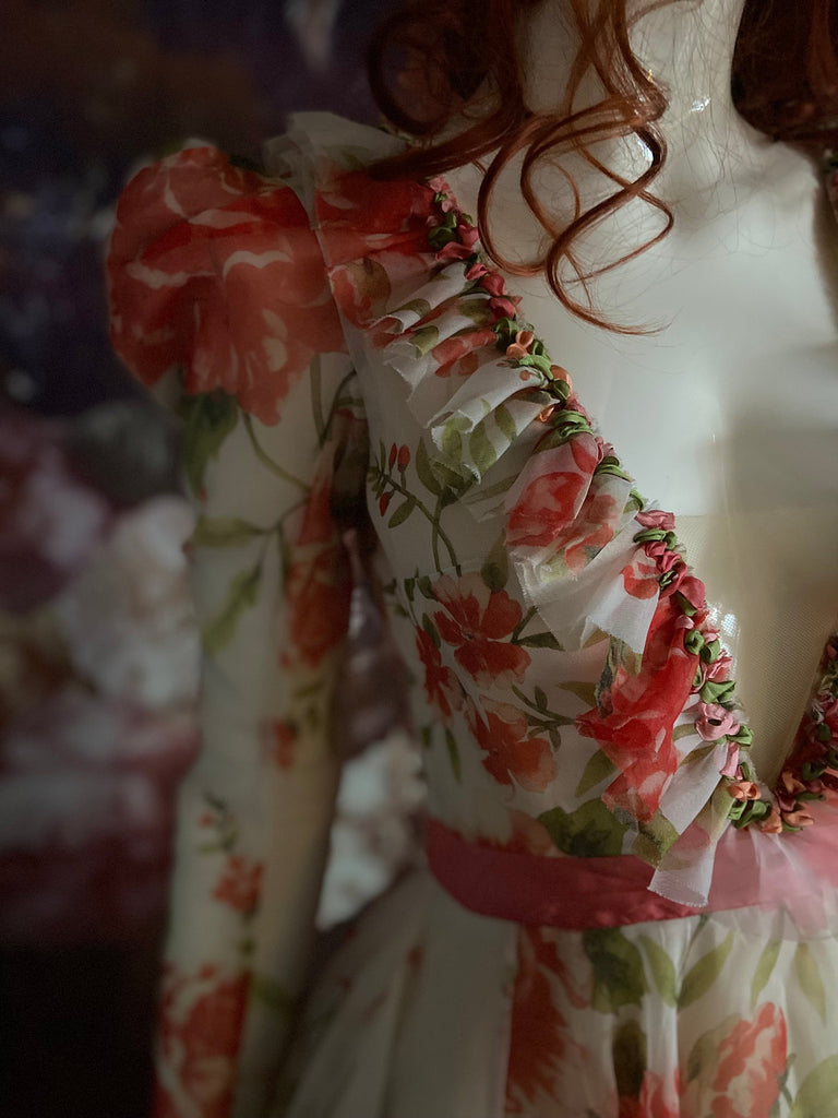 Ivory and coral red floral silk organza ball gown  wedding dress with long puffed sleeves and deep illusion plunge neckline. A Flight of Fancy from Pavilion Parade