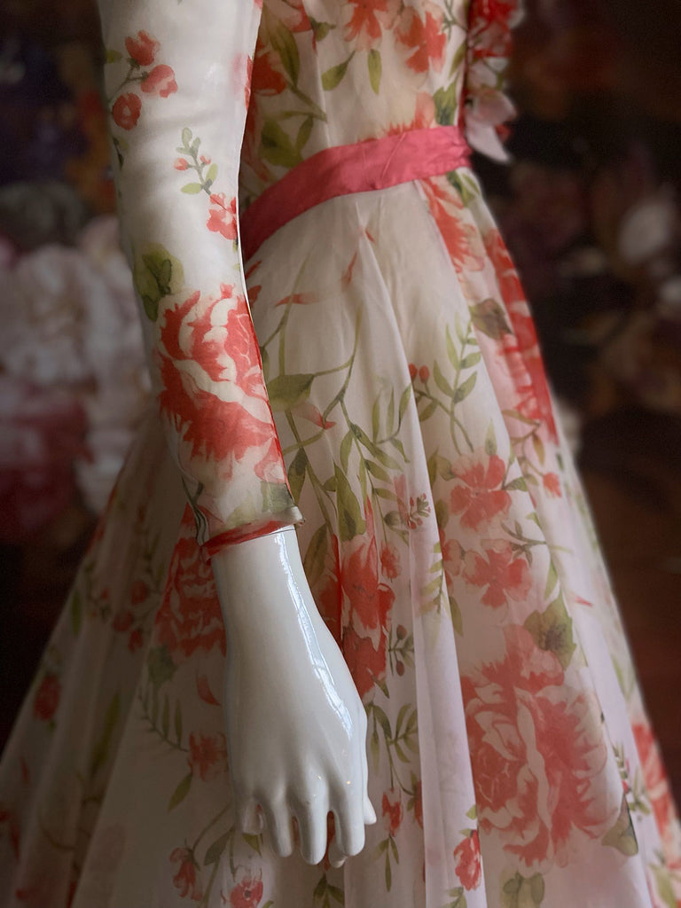 Ivory and coral red floral silk organza ball gown  wedding dress with long puffed sleeves and deep illusion plunge neckline. A Flight of Fancy from Pavilion Parade