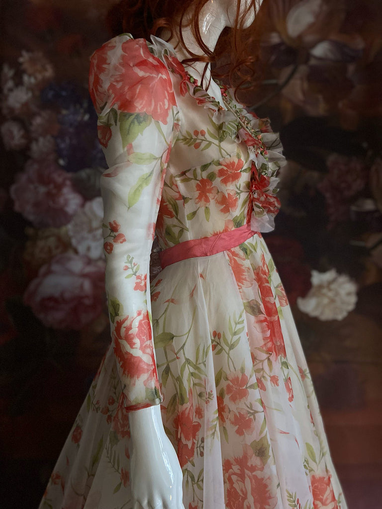 Ivory and coral red floral silk organza ball gown  wedding dress with long puffed sleeves and deep illusion plunge neckline. A Flight of Fancy from Pavilion Parade
