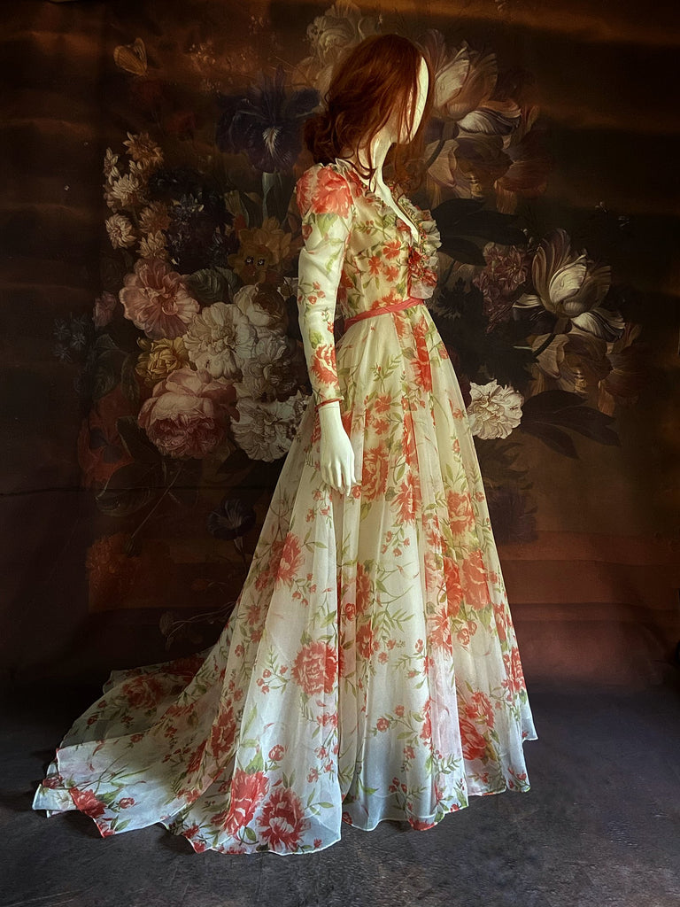 Ivory and coral red floral silk organza ball gown  wedding dress with long puffed sleeves and deep illusion plunge neckline. A Flight of Fancy from Pavilion Parade