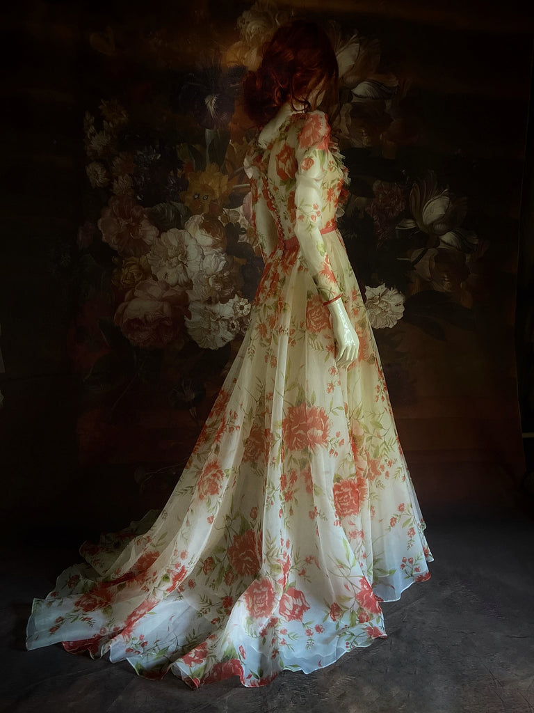 Ivory and coral red floral silk organza ball gown  wedding dress with long puffed sleeves and deep illusion plunge neckline. A Flight of Fancy from Pavilion Parade