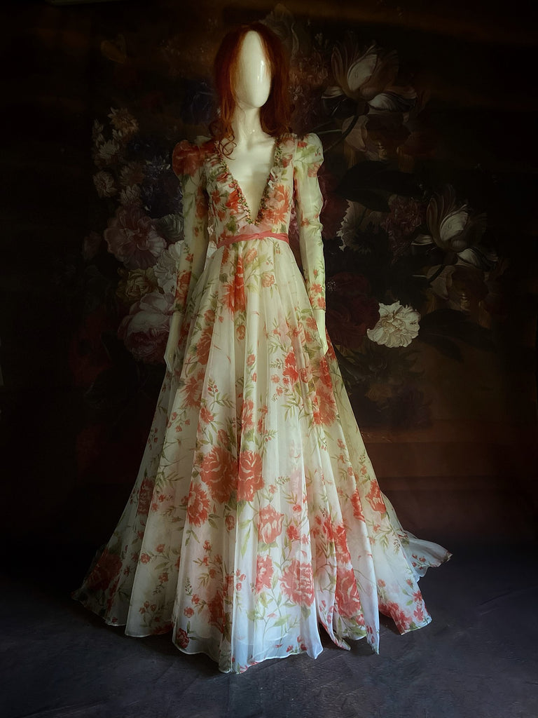 Ivory and coral red floral silk organza ball gown  wedding dress with long puffed sleeves and deep illusion plunge neckline. A Flight of Fancy from Pavilion Parade