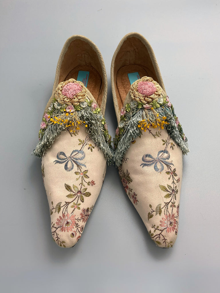 Georgian style silk brocade shoes with blue ribbons and rococo flower trim. Created from antique textiles by the Pavilion Parade studio