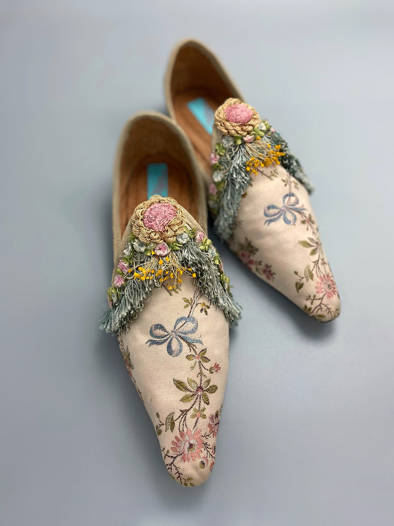 Georgian style silk brocade shoes with blue ribbons and rococo flower trim. Created from antique textiles by the Pavilion Parade studio