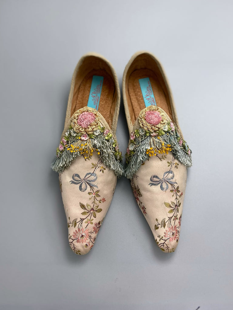 Georgian style silk brocade shoes with blue ribbons and rococo flower trim. Created from antique textiles by the Pavilion Parade studio