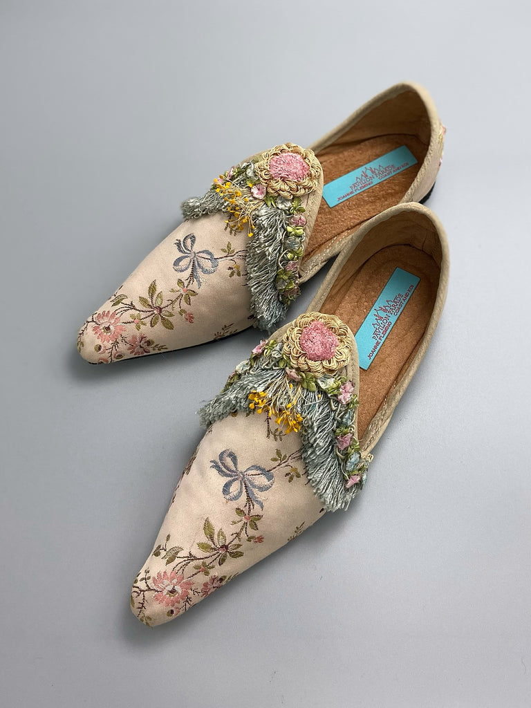 Georgian style silk brocade shoes with blue ribbons and rococo flower trim. Created from antique textiles by the Pavilion Parade studio
