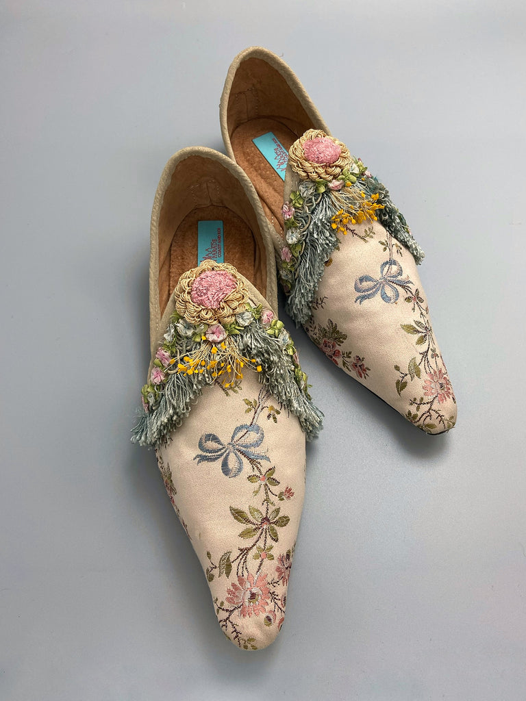 Georgian style silk brocade shoes with blue ribbons and rococo flower trim. Created from antique textiles by the Pavilion Parade studio