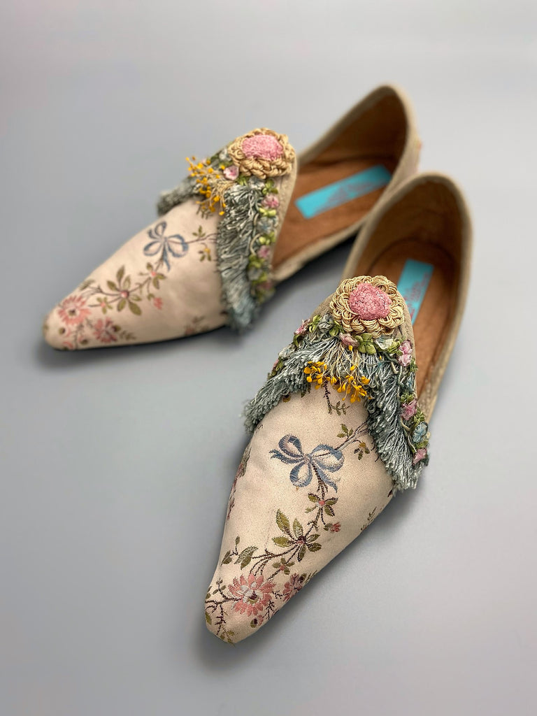 Georgian style silk brocade shoes with blue ribbons and rococo flower trim. Created from antique textiles by the Pavilion Parade studio