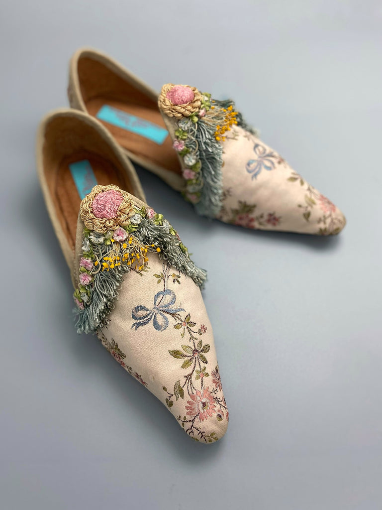 Georgian style silk brocade shoes with blue ribbons and rococo flower trim. Created from antique textiles by the Pavilion Parade studio