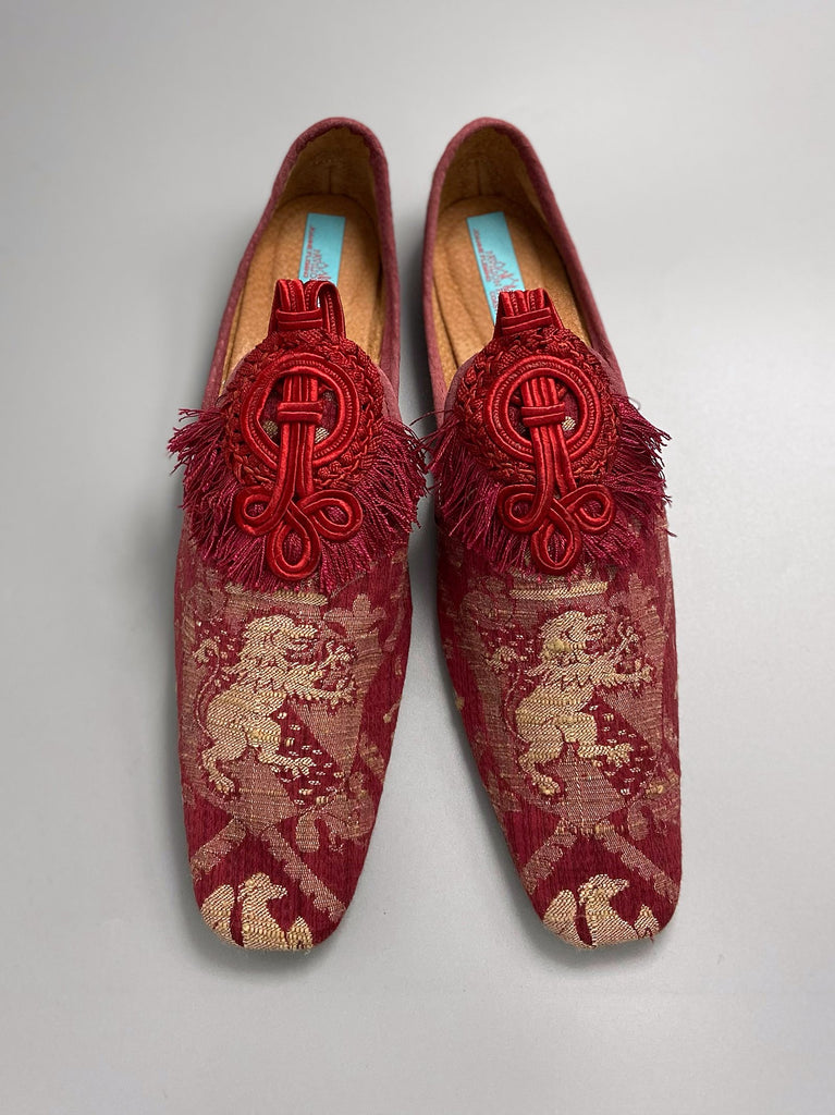 Dark red French brocade slipper shoes with a heraldic design of lions rampant, embellished with antique crimson silk soutache medallions. Created from antique textiles by Pavilion Parade