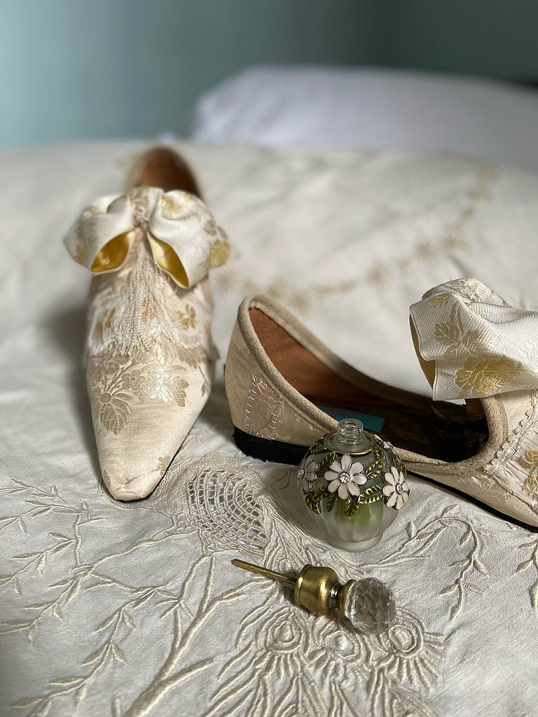 Ivory silk damask bridal boudoir shoes with rococo bows and Victorian tassels. Created from antique textiles by Pavilion Parade