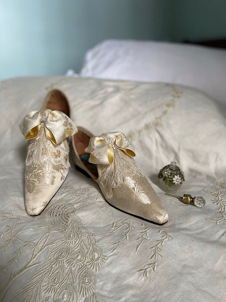 Ivory silk damask bridal boudoir shoes with rococo bows and Victorian tassels. Created from antique textiles by Pavilion Parade