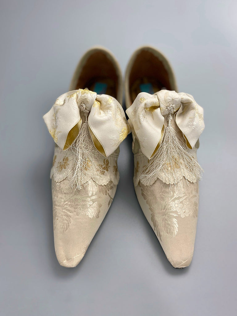 Ivory silk damask bridal boudoir shoes with rococo bows and Victorian tassels. Created from antique textiles by Pavilion Parade