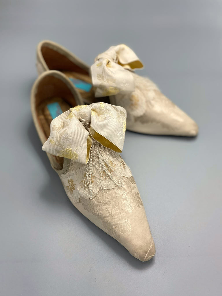 Ivory silk damask bridal boudoir shoes with rococo bows and Victorian tassels. Created from antique textiles by Pavilion Parade
