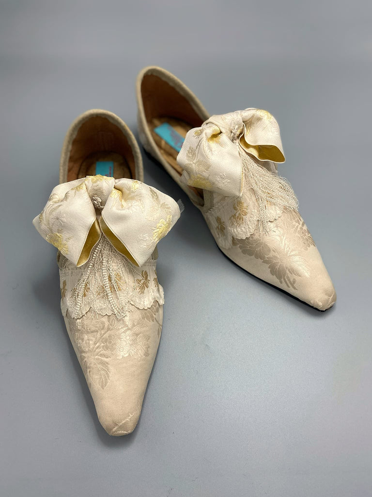 Ivory silk damask bridal boudoir shoes with rococo bows and Victorian tassels. Created from antique textiles by Pavilion Parade