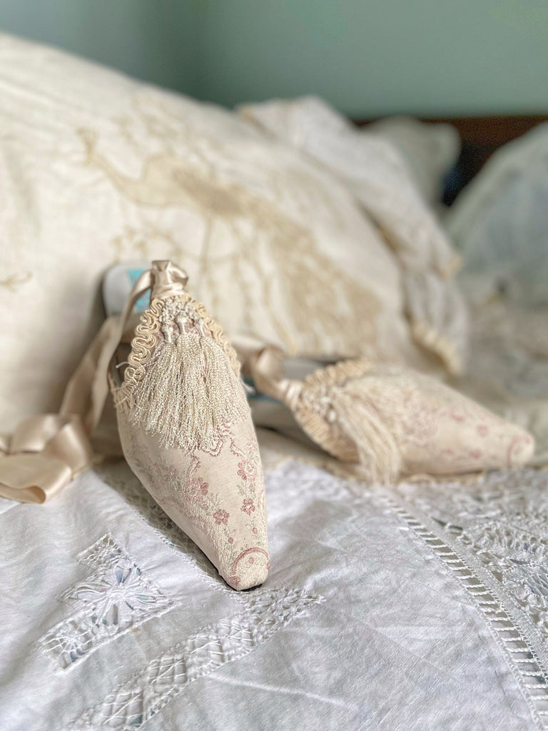 Ivory and pale pink silk brocade bridal boudoir shoes with Victorian tassel embellishment created from antique textiles by Pavilion Parade
