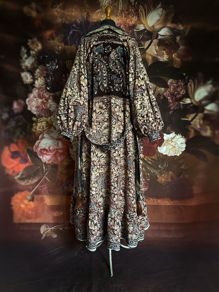 Slate blue and burnt sienna kalamkari and batik cotton reversible robe with very full bishop sleeves. Bohemian style from the Pavilion Parade studio. 