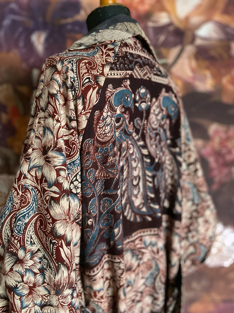 Slate blue and burnt sienna kalamkari and batik cotton reversible robe with very full bishop sleeves. Bohemian style from the Pavilion Parade studio. 