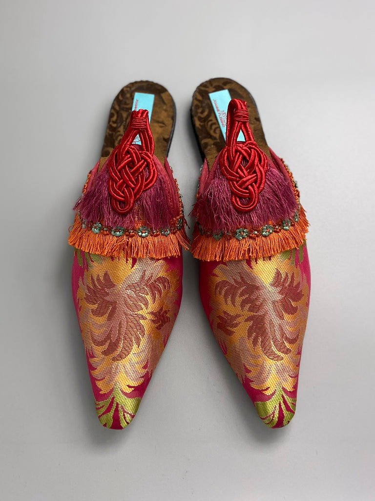 Vibrant pink and orange silk tasseled shoes created from antique textiles from Pavilion Parade