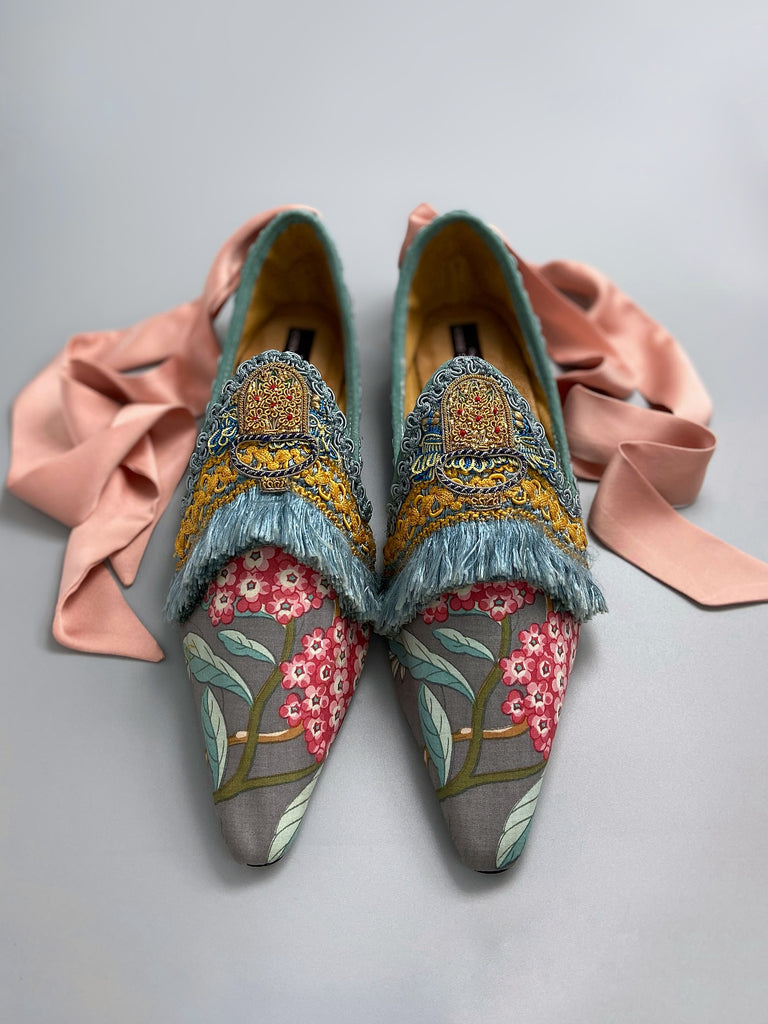 Mitsou Pavilion Parade handmade shoes created from antique textiles,  available from Joanne Fleming Design. Antique French cintz and 19th century passementerie create bohemian flat shoes in shades of pink and teal