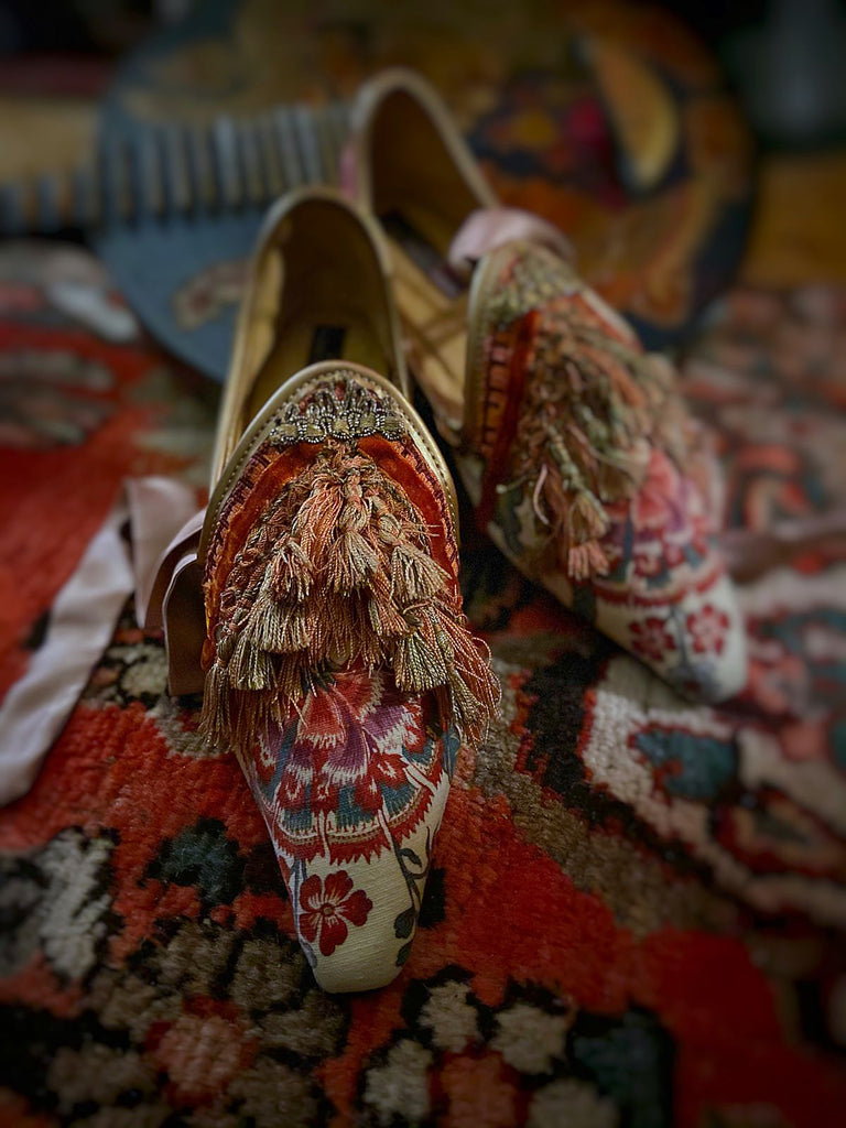 Pavilion Parade handmade shoes created from antique textiles, from available Joanne Fleming Design. 18th century Florentine silk tassels and block printed Indienne cotton create bohemian flat shoes in shades of coral, cream and gold.