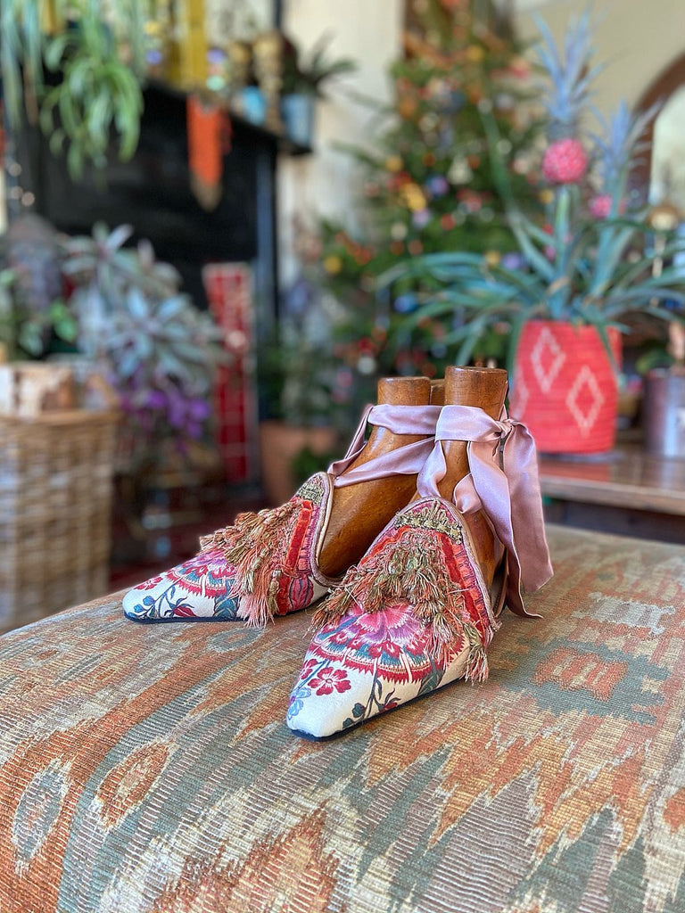 Pavilion Parade handmade shoes created from antique textiles, from available Joanne Fleming Design. 18th century Florentine silk tassels and block printed Indienne cotton create bohemian flat shoes in shades of coral, cream and gold.