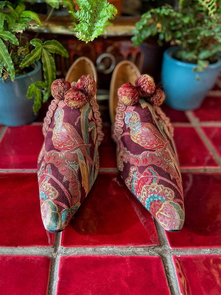 Audubon aubergine and teal shoes with pompom tassel embellishment, created from antique textiles, from the Signature Collection of bohemian footwear by Pavilion Parade at Joanne Fleming Design