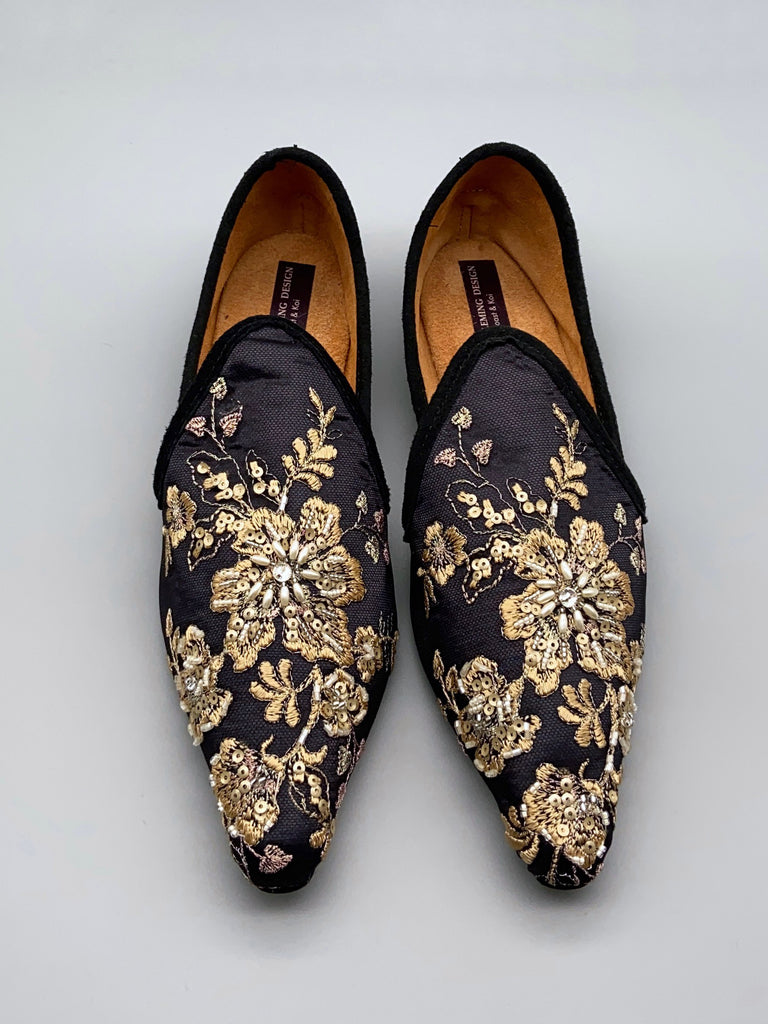 Limited edition beaded embroidered flat babouche style evening shoes in black and gold. Pavilion Parade Recherché Collection from Joanne Fleming Design