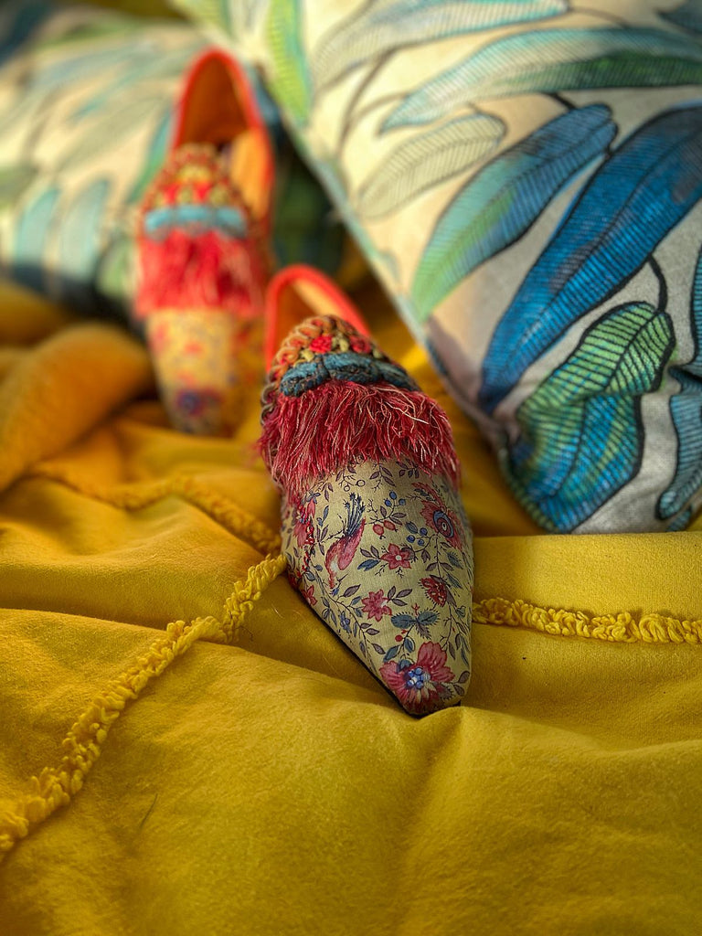 Xanadu yellow and floral shoes with fringed embellishment, created from antique textiles, from the Sigtnature Collection of bohemian footwear by Pavilion Parade at Joanne Fleming Design