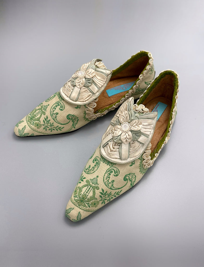 Pea green and creamy ivory brocade pointed toe shoes created from antique textiles. Embellished with original Georgian silk shoe rosettes with mother of pearl detail. Bohemian style from Pavilion Parade.