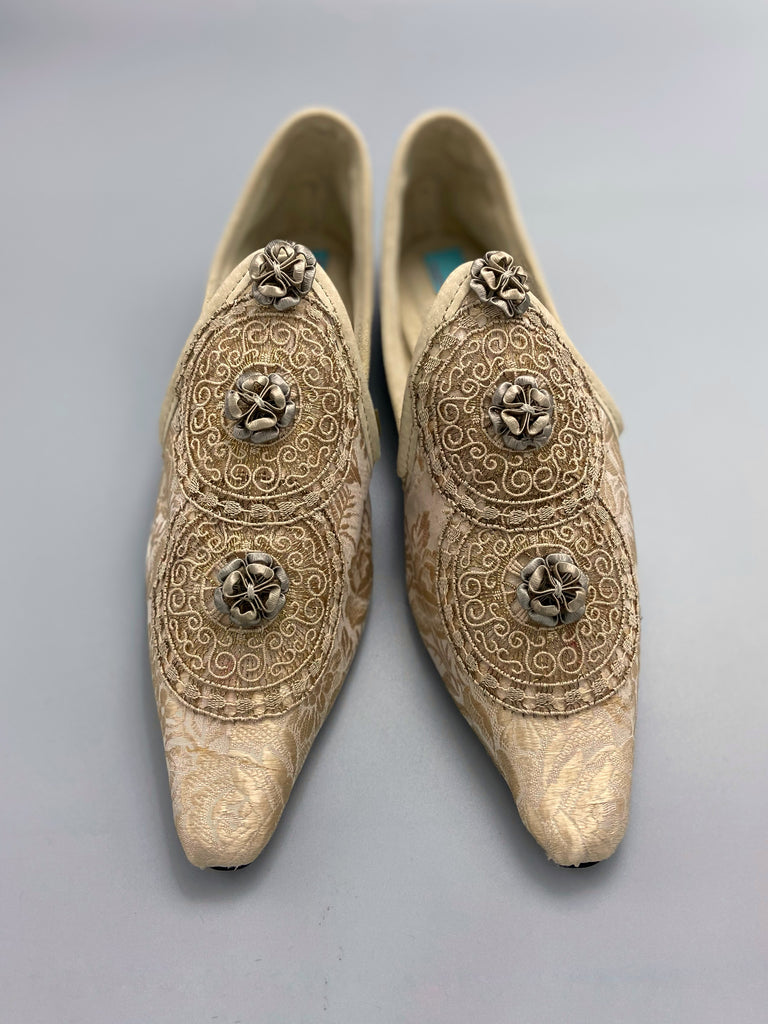 Cream and rose gold silk damask pointed toe shoes  with linen and gold metallic filigree lacework medallions. Finished with little vintage silk passementerie rosettes. Bohemian costume shoes created from antique textiles by Pavilion Parade.