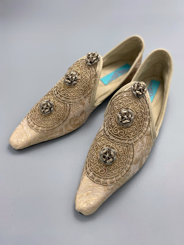 Cream and rose gold silk damask pointed toe shoes  with linen and gold metallic filigree lacework medallions. Finished with little vintage silk passementerie rosettes. Bohemian costume shoes created from antique textiles by Pavilion Parade.