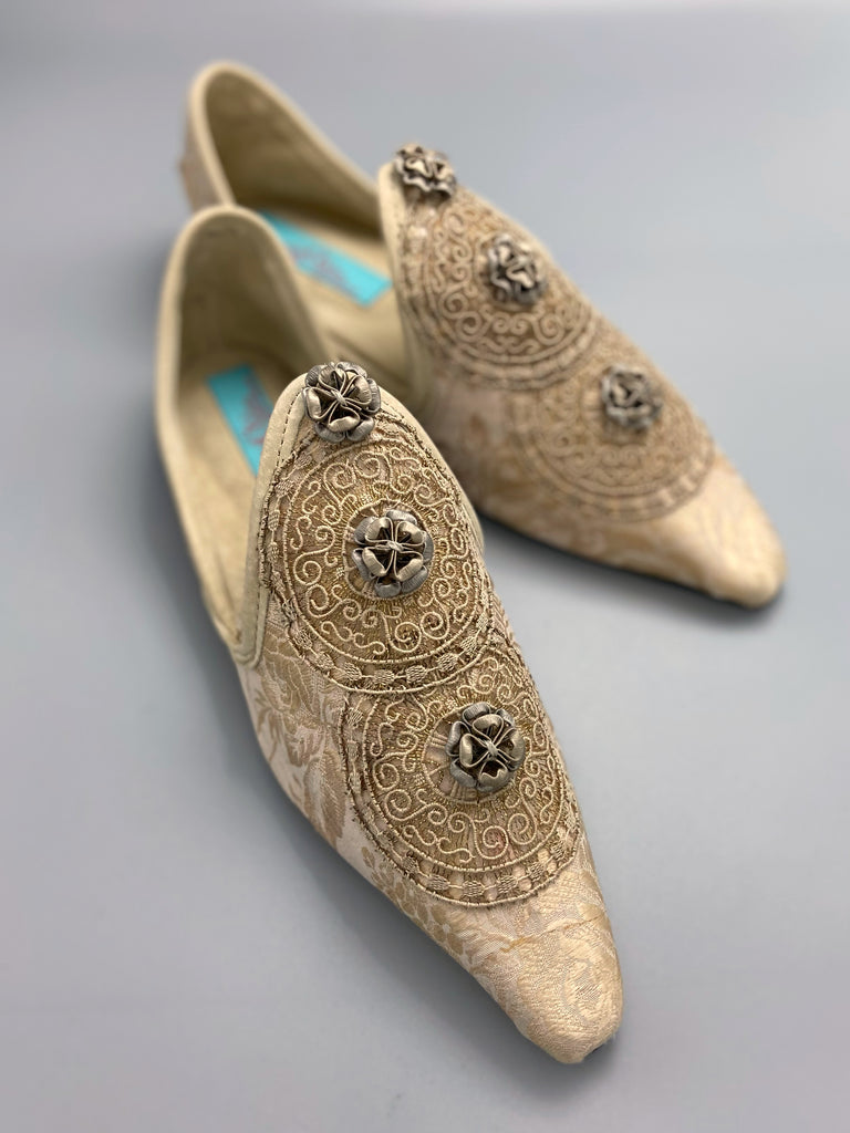 Cream and rose gold silk damask pointed toe shoes  with linen and gold metallic filigree lacework medallions. Finished with little vintage silk passementerie rosettes. Bohemian costume shoes created from antique textiles by Pavilion Parade.