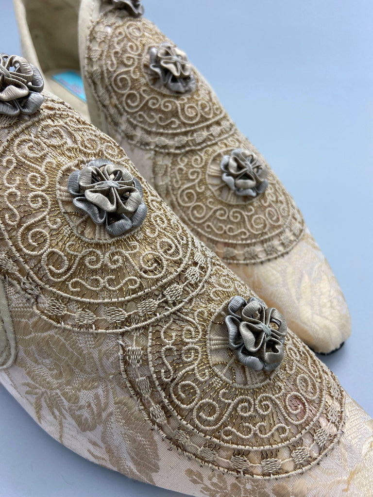 Cream and rose gold silk damask pointed toe shoes  with linen and gold metallic filigree lacework medallions. Finished with little vintage silk passementerie rosettes. Bohemian costume shoes created from antique textiles by Pavilion Parade.