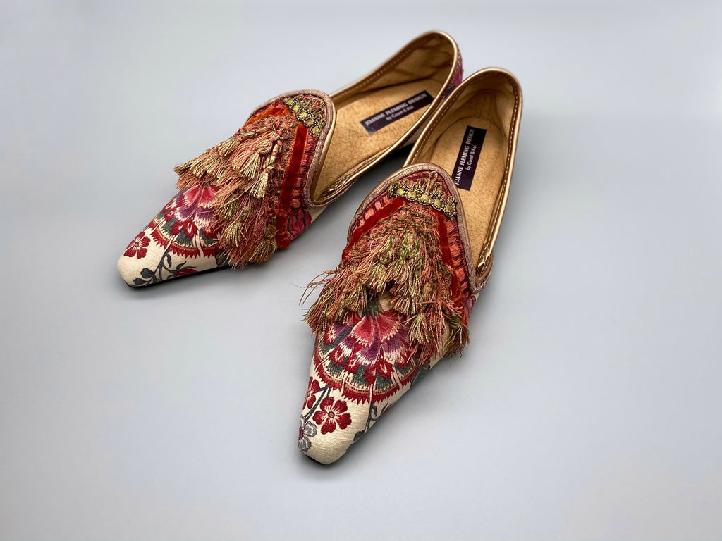 Pavilion Parade handmade shoes created from antique textiles, from available Joanne Fleming Design. 18th century Florentine silk tassels and block printed Indienne cotton create bohemian flat shoes in shades of coral, cream and gold.