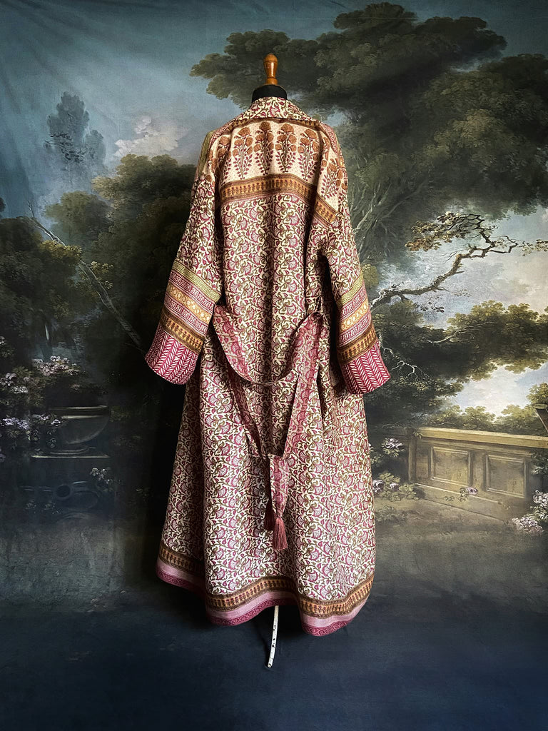 Rose pink and ivory fine wool dressing robe or duster coat with tassel sash, wide sleeves and deep pockets. Lined in silk. Bohemian style sustainably created from antique and vintage textiles by the Pavilion Parade studio.