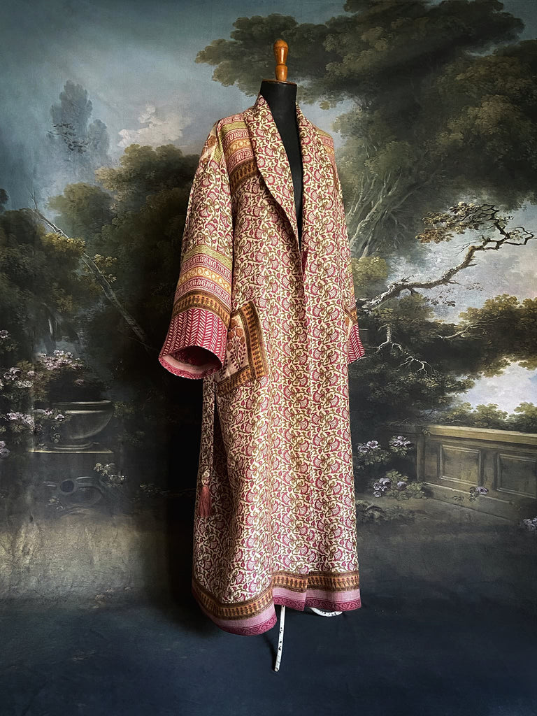 Rose pink and ivory fine wool dressing robe or duster coat with tassel sash, wide sleeves and deep pockets. Lined in silk. Bohemian style sustainably created from antique and vintage textiles by the Pavilion Parade studio.