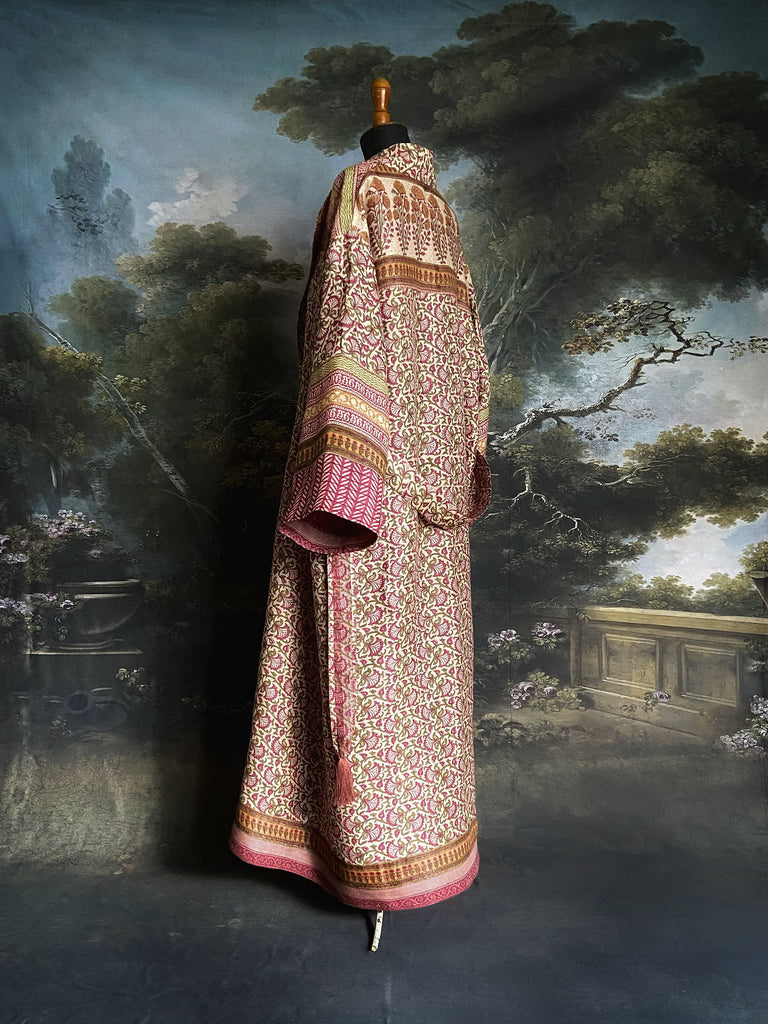 Rose pink and ivory fine wool dressing robe or duster coat with tassel sash, wide sleeves and deep pockets. Lined in silk. Bohemian style sustainably created from antique and vintage textiles by the Pavilion Parade studio.