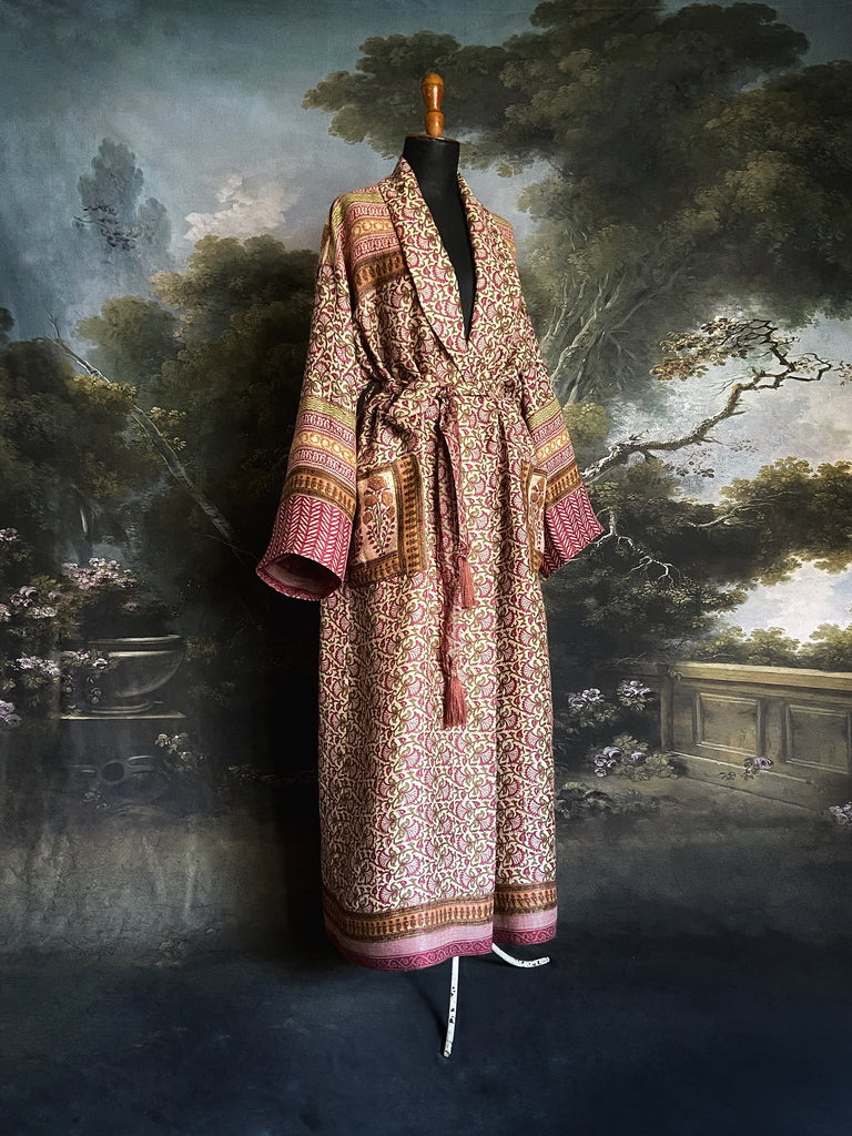 Rose pink and ivory fine wool dressing robe or duster coat with tassel sash, wide sleeves and deep pockets. Lined in silk. Bohemian style sustainably created from antique and vintage textiles by the Pavilion Parade studio.