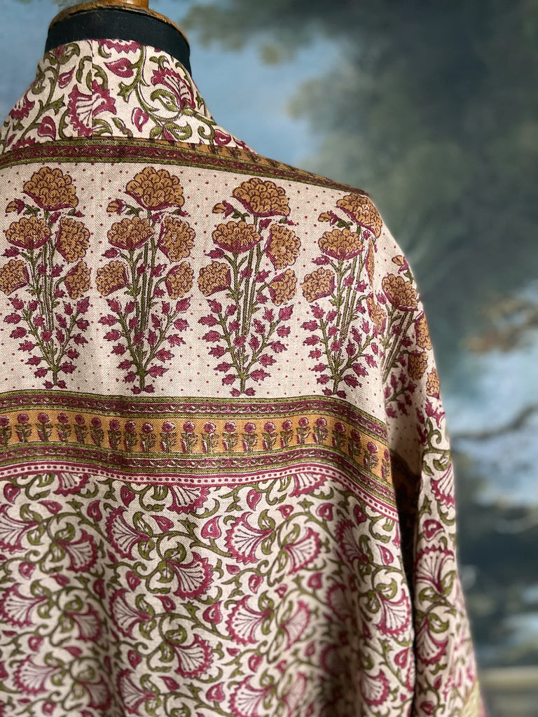 Rose pink and ivory fine wool dressing robe or duster coat with tassel sash, wide sleeves and deep pockets. Lined in silk. Bohemian style sustainably created from antique and vintage textiles by the Pavilion Parade studio.