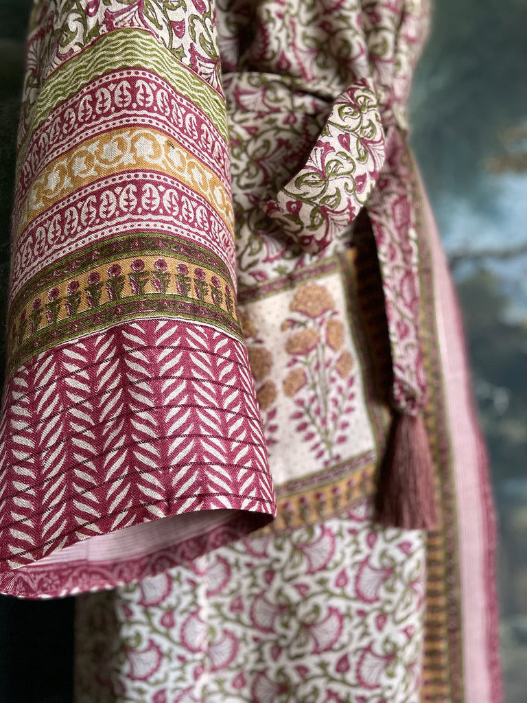 Rose pink and ivory fine wool dressing robe or duster coat with tassel sash, wide sleeves and deep pockets. Lined in silk. Bohemian style sustainably created from antique and vintage textiles by the Pavilion Parade studio.