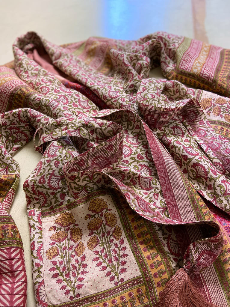 Rose pink and ivory fine wool dressing robe or duster coat with tassel sash, wide sleeves and deep pockets. Lined in silk. Bohemian style sustainably created from antique and vintage textiles by the Pavilion Parade studio.