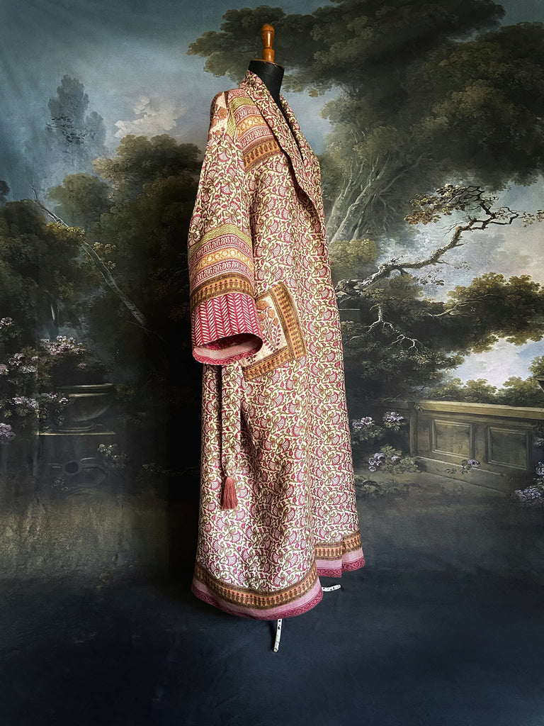 Rose pink and ivory fine wool dressing robe or duster coat with tassel sash, wide sleeves and deep pockets. Lined in silk. Bohemian style sustainably created from antique and vintage textiles by the Pavilion Parade studio.