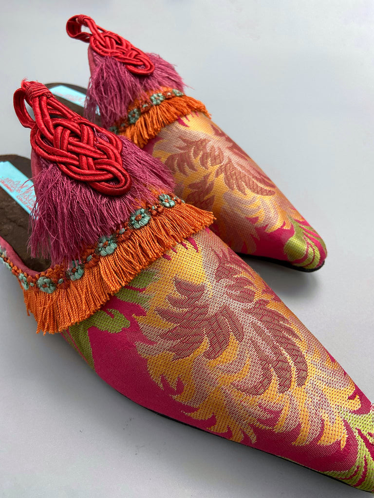Vibrant pink and orange silk tasseled shoes created from antique textiles from Pavilion Parade