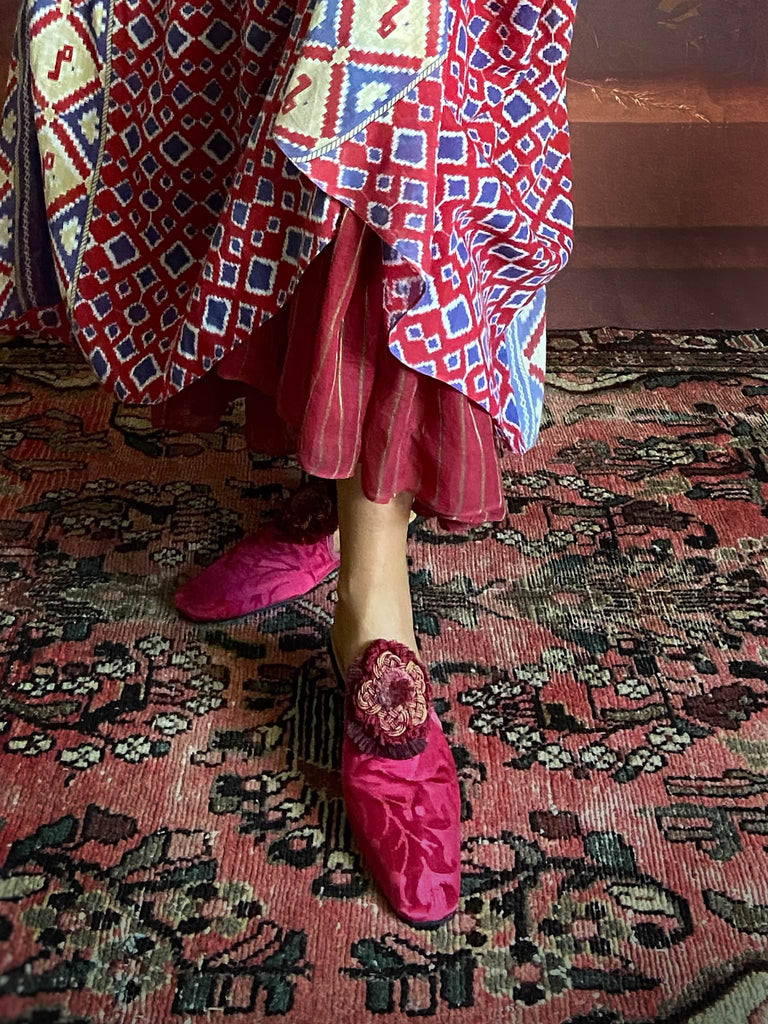 Ruby red and Persian blue printed ikat fine cotton muslin dress with full balloon sleeves, pockets and tiered hem. Bohemian style from the Pavilion Parade studio.
