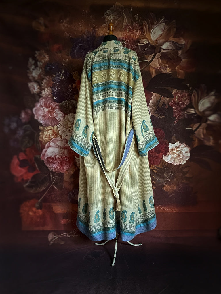 Robins egg blue and parchment fine wool dressing robe or duster coat. Wide cuffs, tassel sash and deep pockets.. Fully lined in silk. Created from vintage textiles by the Pavilion Parade studio.