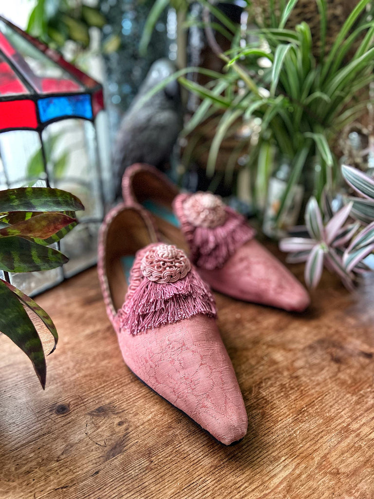 Rose pink silk damask pointed toe shoes with tassel fringe and vintage passementerie rosettes. Created from antique textiles by Pavilion Parade