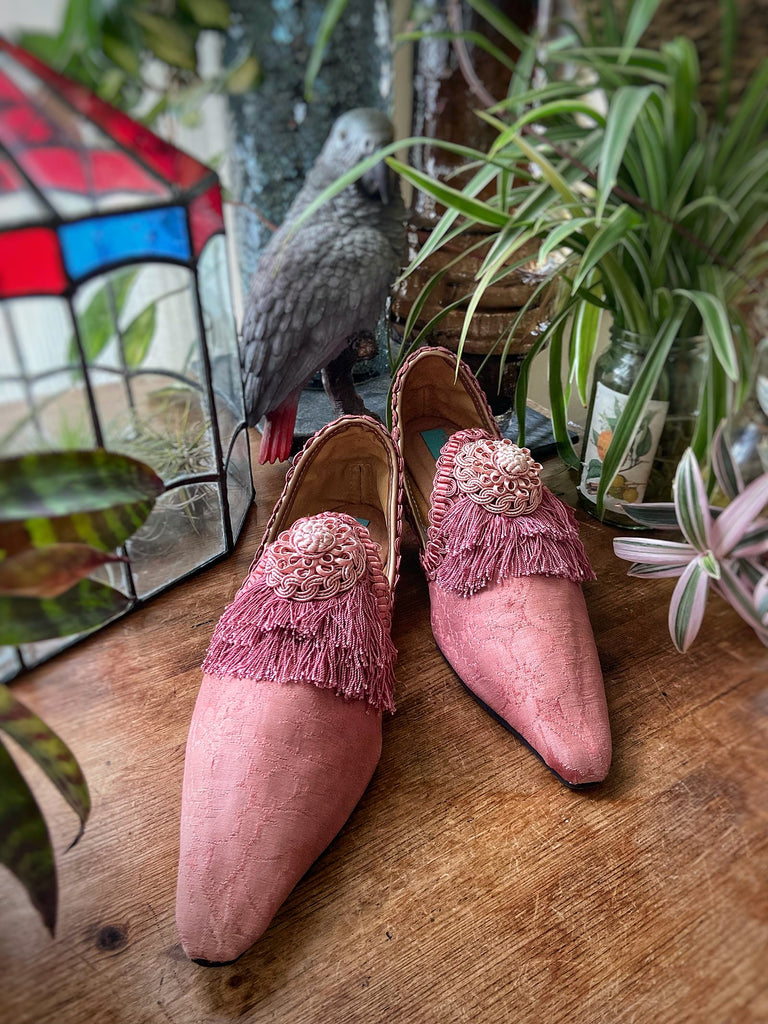 Rose pink silk damask pointed toe shoes with tassel fringe and vintage passementerie rosettes. Created from antique textiles by Pavilion Parade