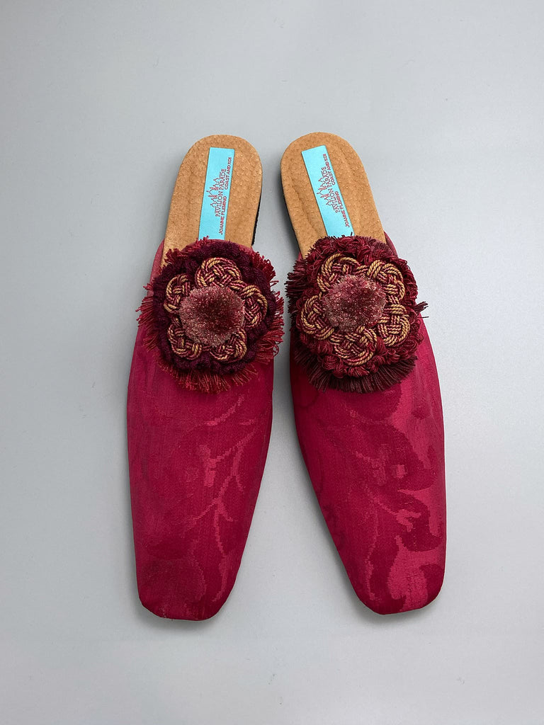 Raspberry red 19th century silk damask square toed backless slipper shoes with antique French passementerie silk chenille and cord medallion rosettes. Bohemian style created from antique textiles by the Pavilion Parade studio.